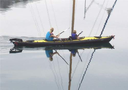 Adult and child in Feathercraft double kayak
