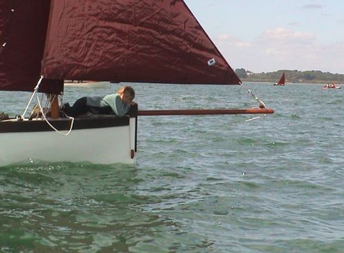 Child at bow of sailboat