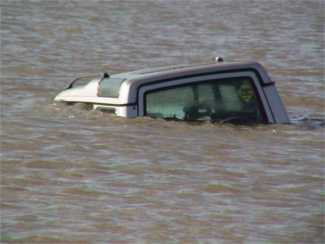 Vehicle covered by rising tide